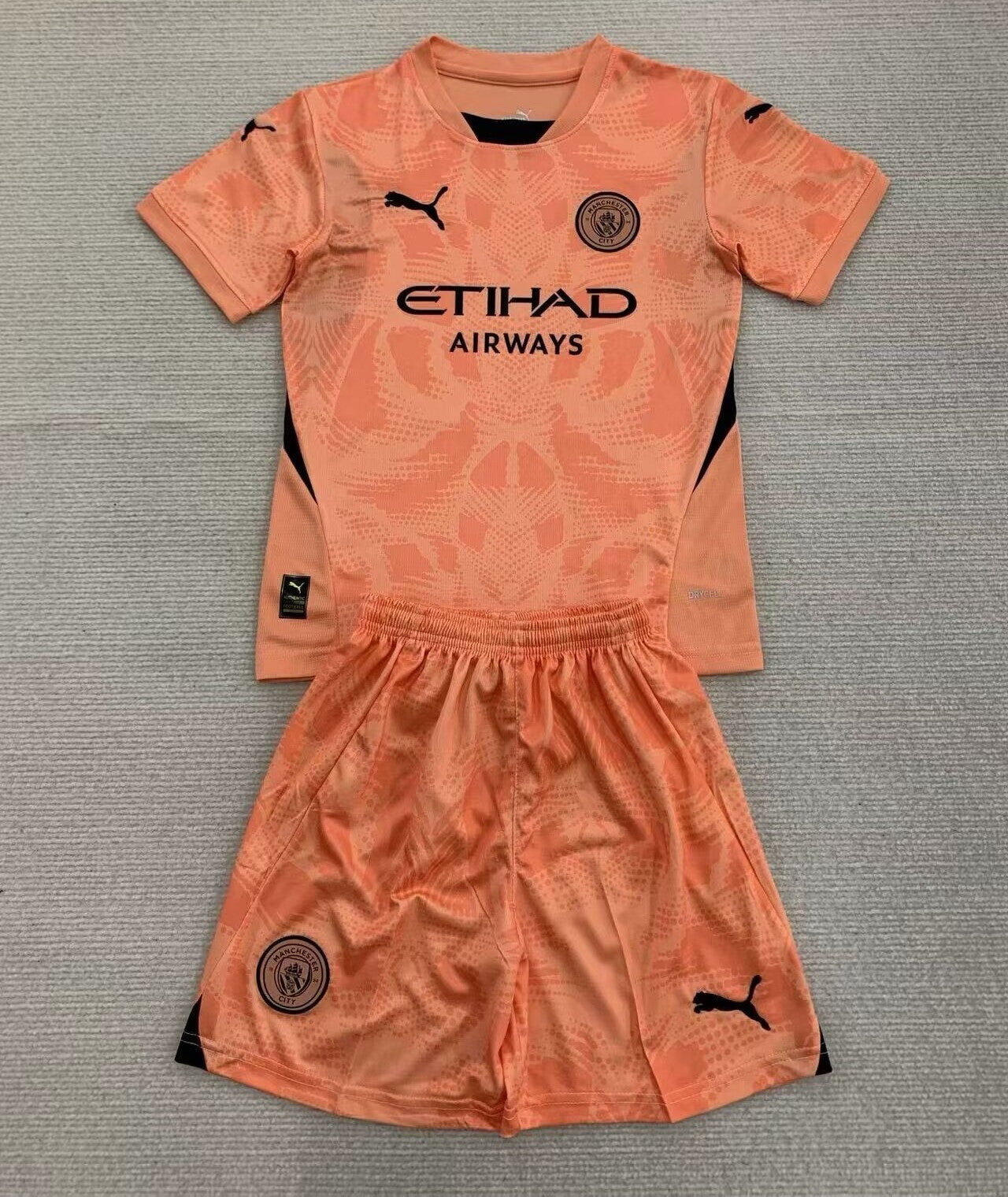 Man City. Orange 24/25 Kids Kit (Includes Shorts)