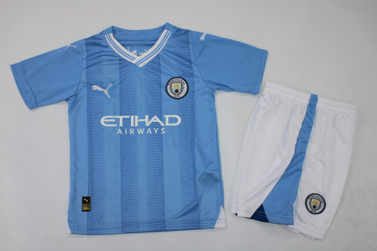 Man. City Home 23/24 Kids Kit (includes shorts)